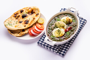 Spinach egg curry is an Indian non vegetarian dish made using palak gravy with eggs