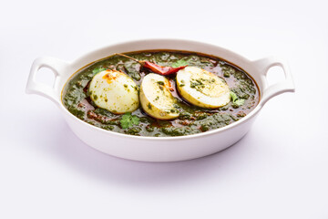 Spinach egg curry is an Indian non vegetarian dish made using palak gravy with eggs