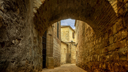 Alley of the historic center of the city of Baeza, a UNESCO World Heritage Site, in Jaen, Spain with natural lighting