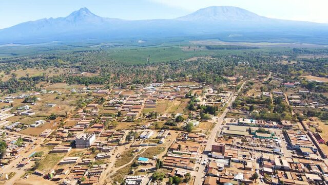 Mount kilimanjaro view . Small settlement of houses with Kilimanjaro background. Kilimanjaro Africa kenya Oloitokitok area.