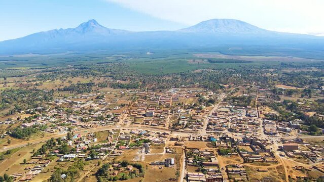 Mount kilimanjaro view . Small settlement of houses with Kilimanjaro background. Kilimanjaro Africa kenya Oloitokitok area.