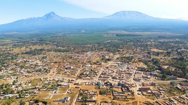 Mount kilimanjaro view . Small settlement of houses with Kilimanjaro background. Kilimanjaro Africa kenya Oloitokitok area.