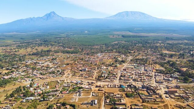 Mount kilimanjaro view . Small settlement of houses with Kilimanjaro background. Kilimanjaro Africa kenya Oloitokitok area.