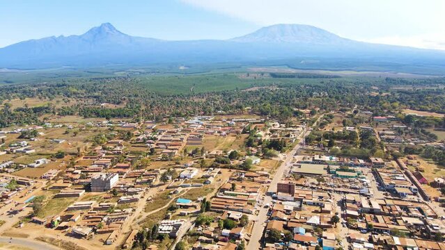 Mount kilimanjaro view . Small settlement of houses with Kilimanjaro background. Kilimanjaro Africa kenya Oloitokitok area.