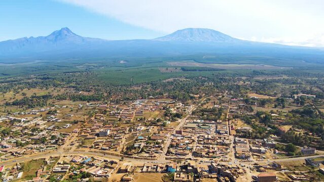 Mount kilimanjaro view . Small settlement of houses with Kilimanjaro background. Kilimanjaro Africa kenya Oloitokitok area.