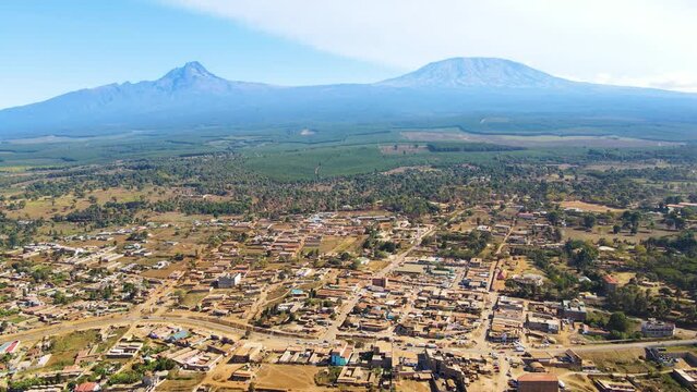 Mount kilimanjaro view . Small settlement of houses with Kilimanjaro background. Kilimanjaro Africa kenya Oloitokitok area.