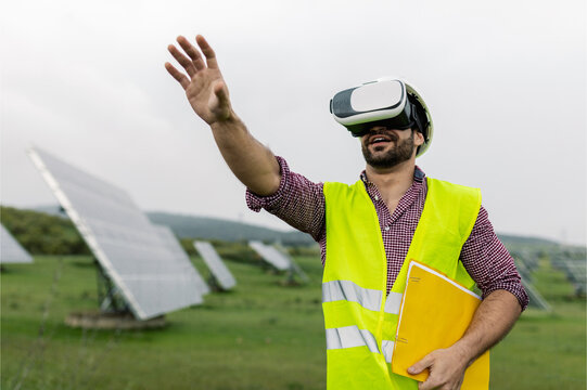 Male technician examining scheme in virtual reality