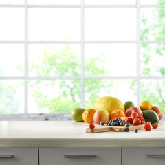 Fresh fruits on desk and window background. 