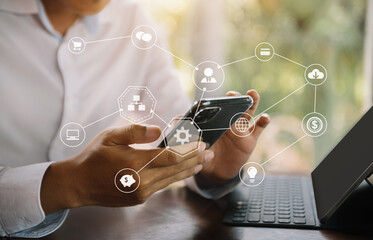 Business men hand working with smart phone and tablet in modern office with virtual icon diagram at modern office.