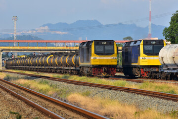 Freight trains by diesel locomotive on the railway yard in Thailand