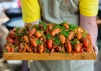 Boiled red crayfish or crawfish with herbs. Crayfish boiling in the pot on the fire