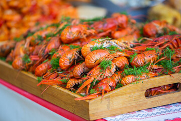 Boiled red crayfish or crawfish with herbs. Crayfish boiling in the pot on the fire