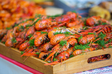 Boiled red crayfish or crawfish with herbs. Crayfish boiling in the pot on the fire