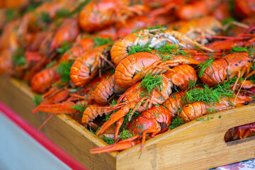 Boiled red crayfish or crawfish with herbs. Crayfish boiling in the pot on the fire