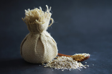 World grain crisis. A handful of cereals and on a dark background.