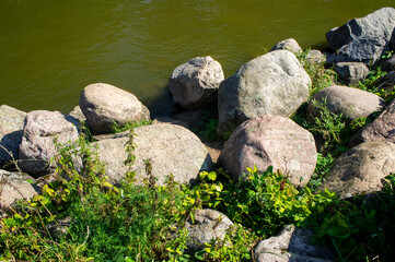 Large stones boulders near a mountain river