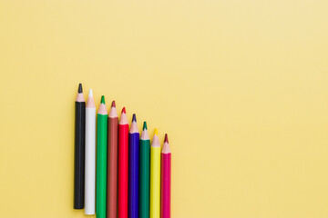 Background from color pencils on yellow paper. Color pencil with copy space isolated on yellow...
