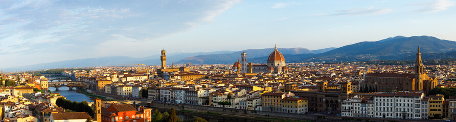 Beautiful panoramic view of the picturesque city of Florence and the Basilica di Santa Maria del Fiore (Basilica of Saint Mary of the Flower), Ponte Vecchio and Giotto's Campanile at sunrise, Florenc