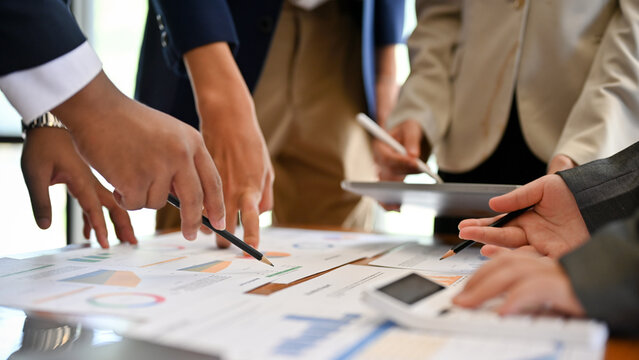 Professional financial analysts working together. cropped and close-up hands image.
