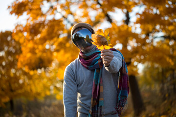 Fototapeta premium person in the autumn park. Man autumn. Fall. Hero. Hope. Mask face. Park. Male. 