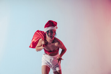 Obraz premium Christmas woman. Santa hat woman. Christmas. Gifts. Holidays. Dream. Gifts. Fun. 