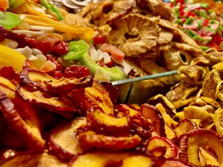 Healthy dried fruits in grand bazaar. Strawberry, mango, apple, pineapple and other dried fruits on a table