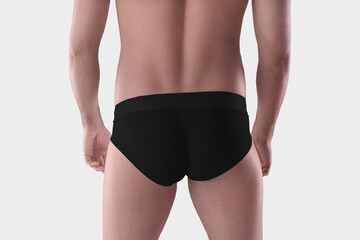 Mockup of black underpants on a sporty guy, fashionable underwear on a man, back view, isolated on...