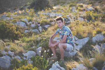 Guy posing alone on the Mediterranean coast