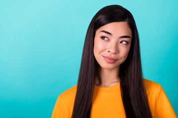 Photo of adorable cute nice woman long hairdo dressed yellow t-shirt thoughtful look at empty space...
