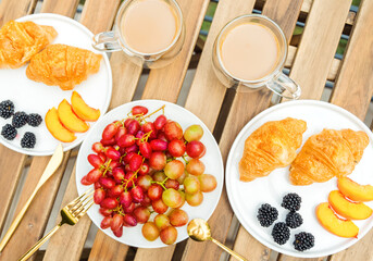 Excellent breakfast on the terrace in the garden, top view.