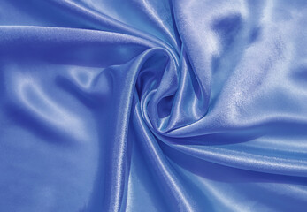 Smooth elegant blue silk or satin luxury cloth texture can use as abstract background. Luxurious...