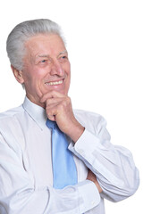 close up portrait of senior businessman in formal wear posing