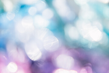 Blurred bokeh background for Christmas and New Year holiday. Abstract colorful wallpaper with defocused lights. Copy space