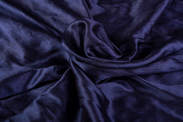 Shiny silk fabric in blue color making a background