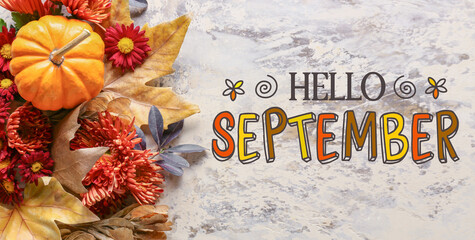 Text HELLO SEPTEMBER ad beautiful autumn composition on grunge background