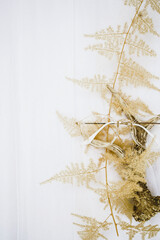  background with neutral tones a dry fern, a deer horn and retro glasses