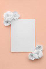 Paper sheet with flowers on pink background