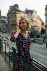 Fototapeta premium A middle-aged woman on the street of an old European city.
