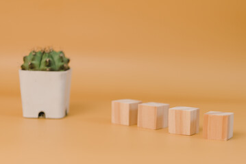 wood cube block blank and tree on yellow background.