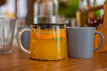 Sea ​​buckthorn tea in the glass teapot