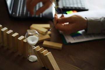 Closeup thick domino wood block in a row stop the falling, be stable in crisis, business solution concept