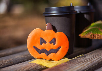 Coffee cup and skeleton cookie, pumpkin cookie. Halloween decoration