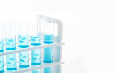 concept of science biology test tube with blue liquid on white background                                      