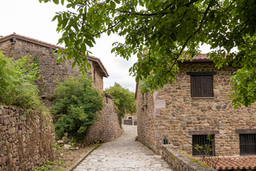 Fototapeta na wymiar typical street and buildings in the village of barcena mayor in cantabria in northern spain