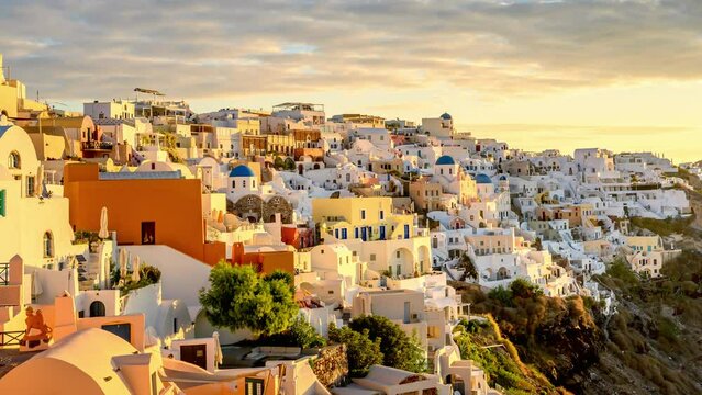 TIME LAPSE Picturesque sunset on famous view resort over Oia town on Santorini island, Greece, Europe. luxury travel. famous travel landscape. Summer holidays.