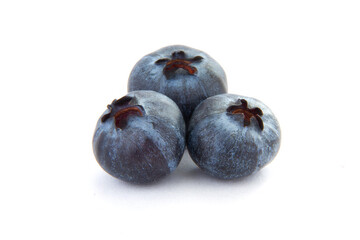 Ripe blueberries are blue-purple on an isolated background. White background. Useful berry