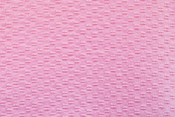 A surface of pink structured clean tissue paper texture as background
