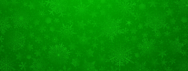 Background of complex big and small Christmas snowflakes in green colors. Winter illustration with falling snow