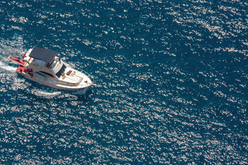 Fototapeta premium Speed boat on the sea. Aerial top view. Vacation and holidays concept. Copy space