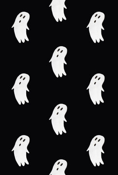 Horror pattern made of ghosts on black background. Minimal spooky idea. Halloween or Santa Muerte concept.